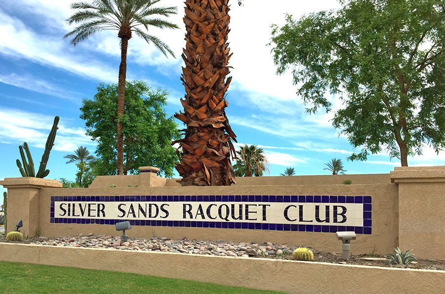 A sign for the silver sands racquet club