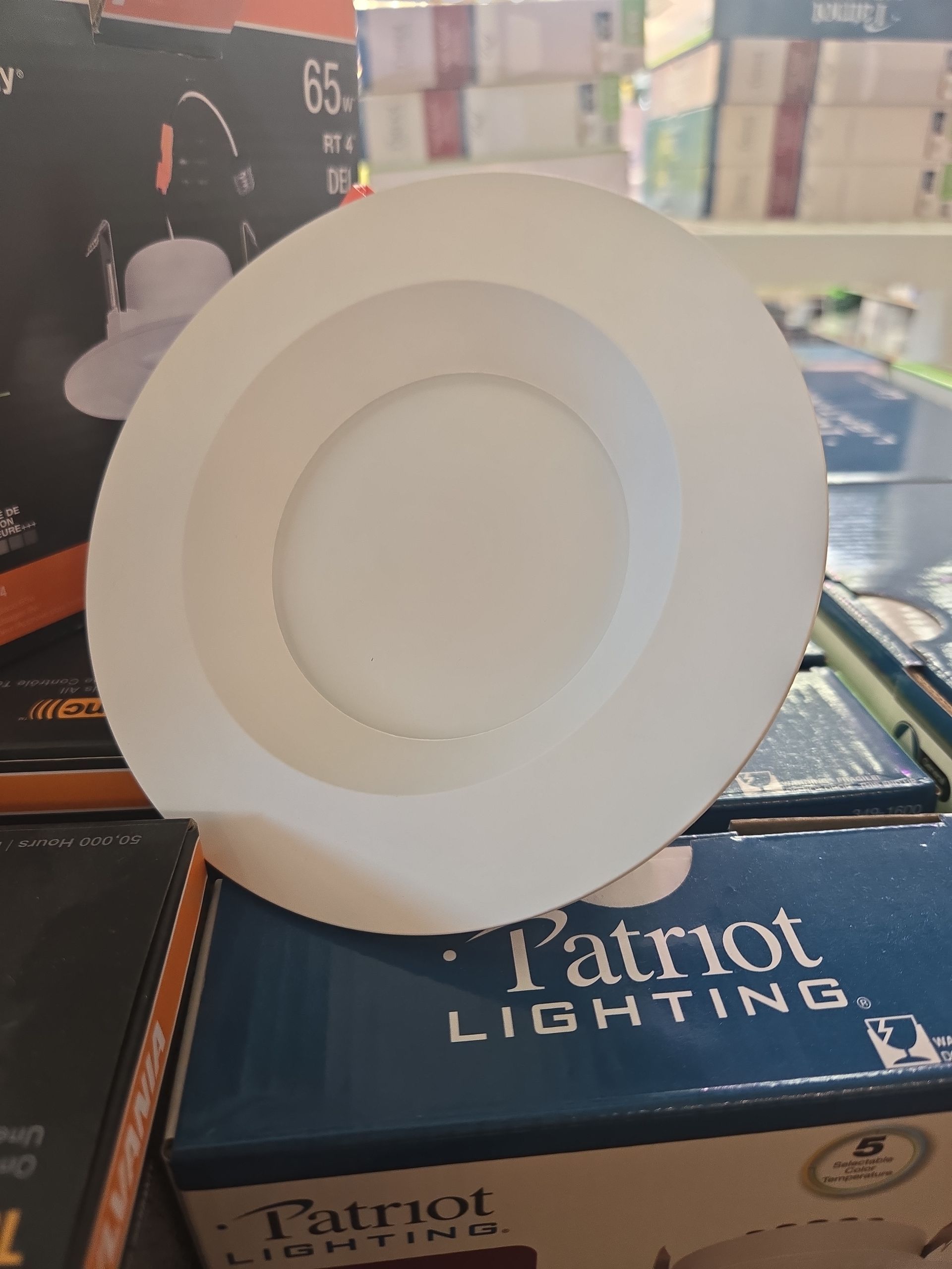 A white plate is sitting on top of a patriot lighting box.
