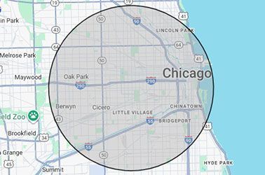 Map of Chicago with a gray circle overlaid, showing the city and surrounding areas, including neighborhoods and highways.