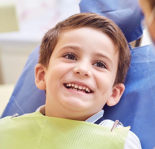Kid in dentist chair