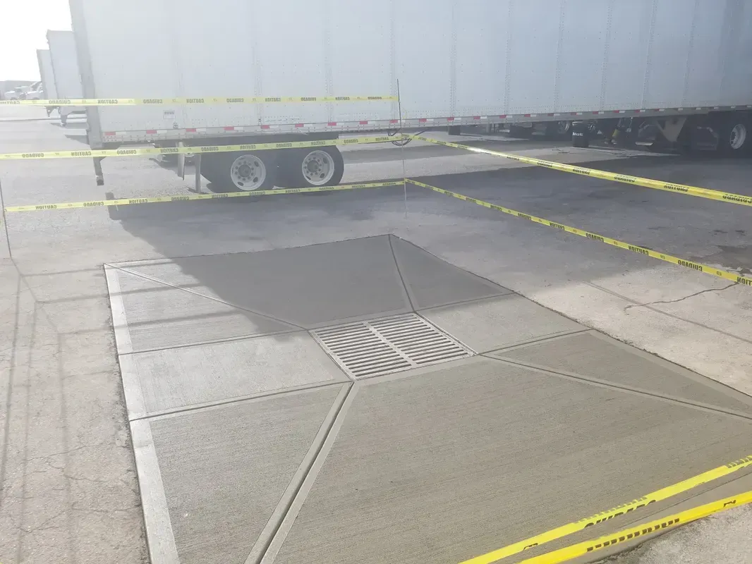 A truck is parked in a parking lot with yellow tape around it.