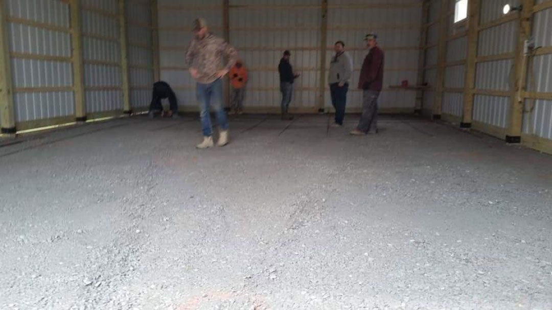 A group of people are standing inside a building.