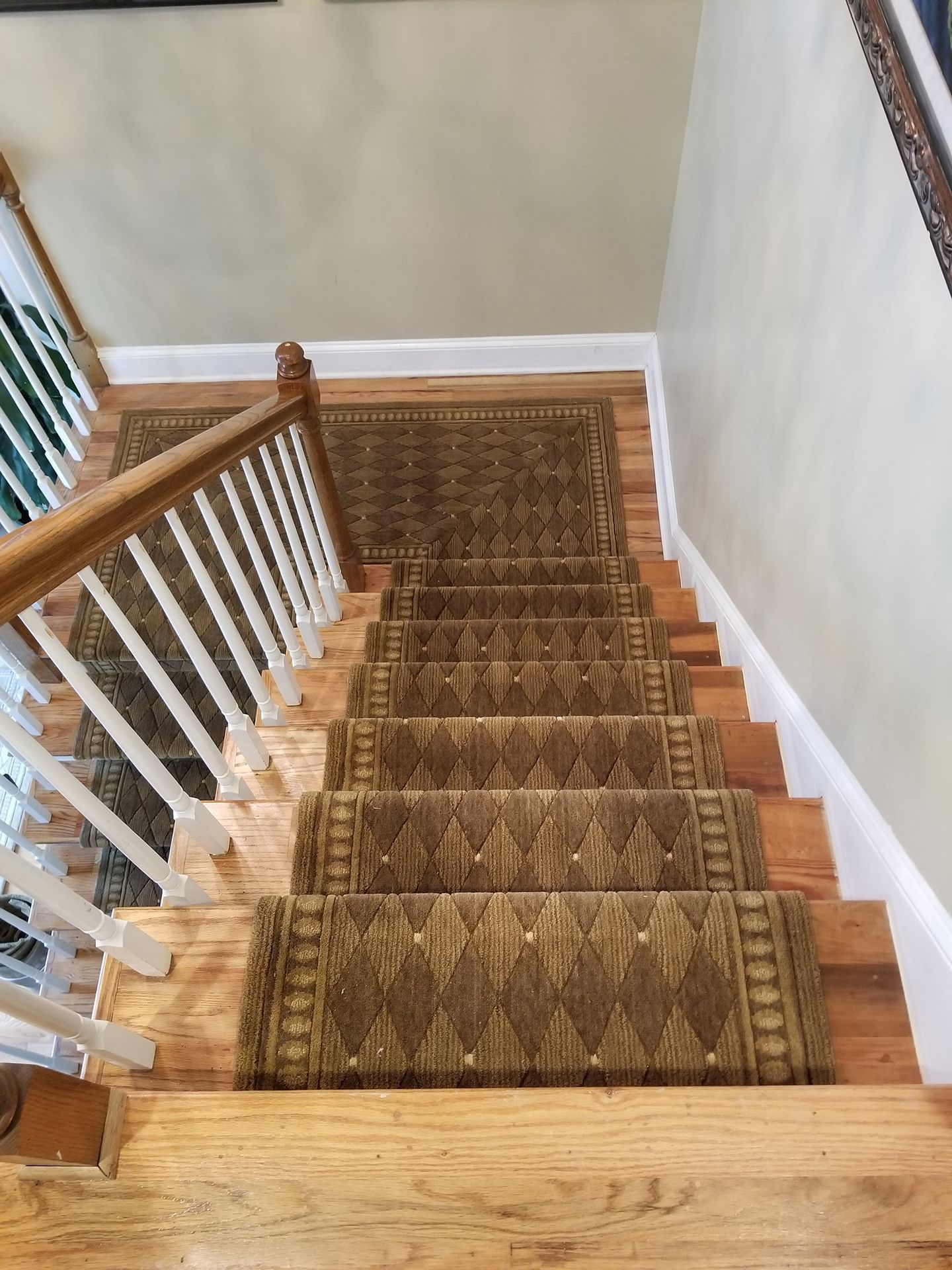 Newly installed brown stair runner