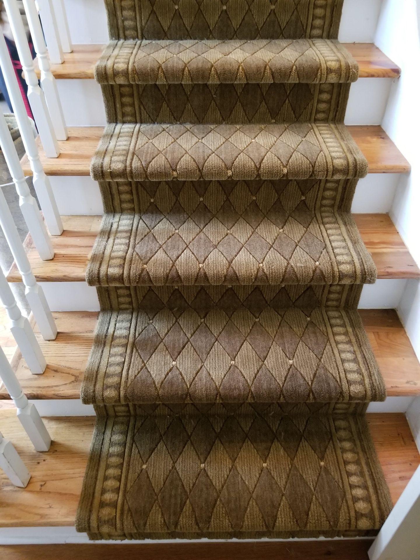 Brown stair runner installation