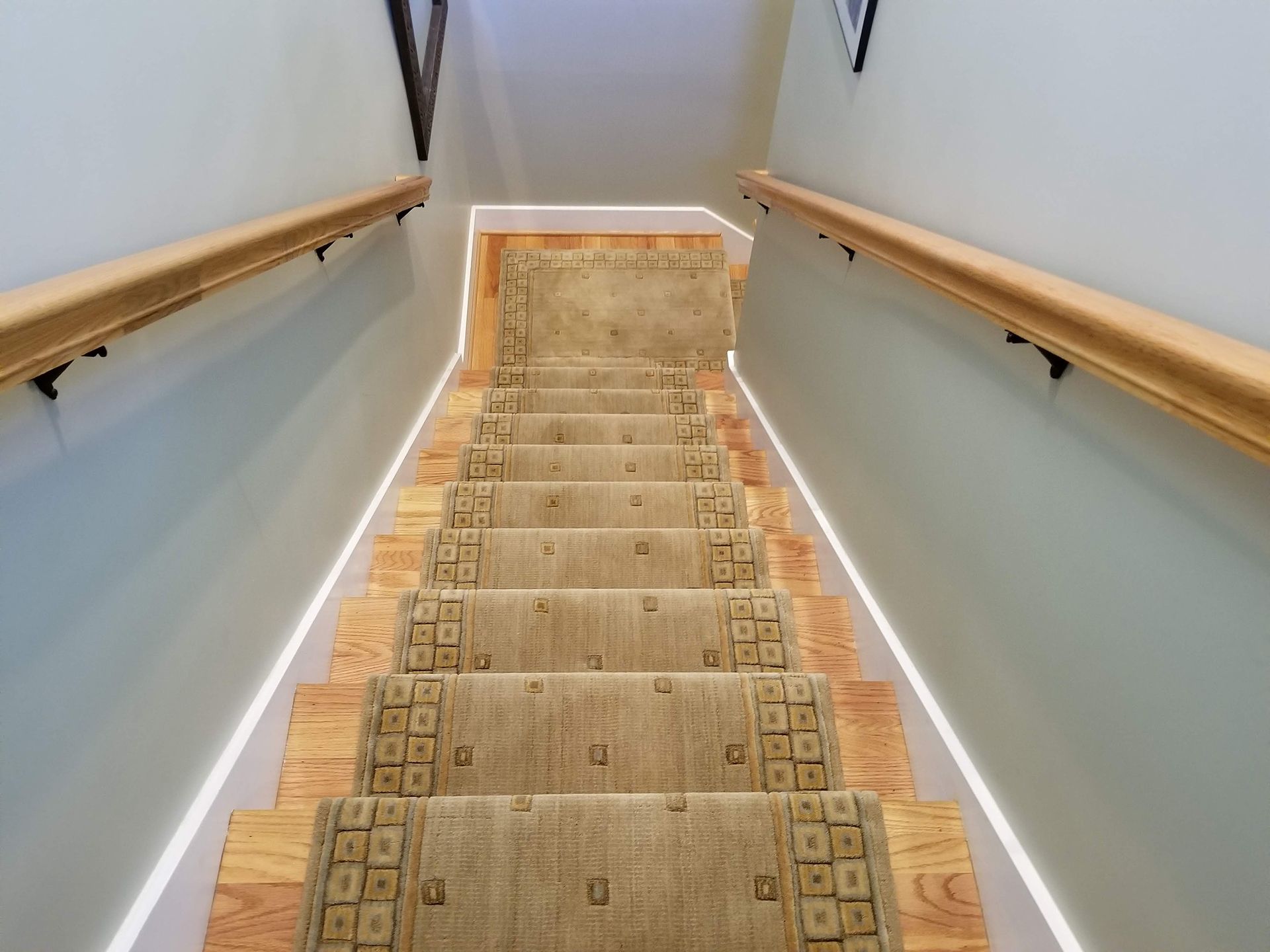 Brown stair rug installation