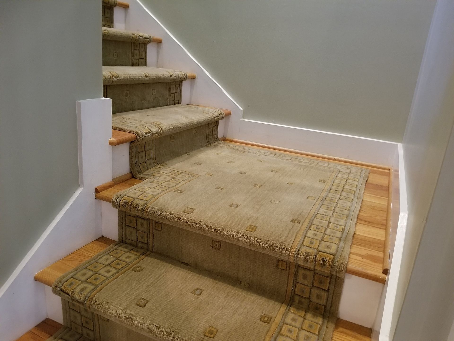 Brown stair rug installations