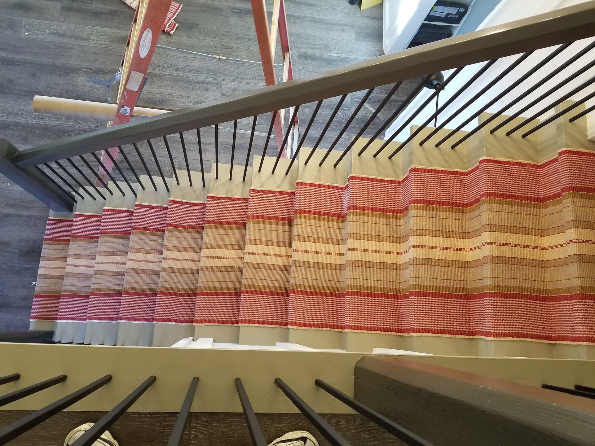 Red & brown stripe floor runner installation