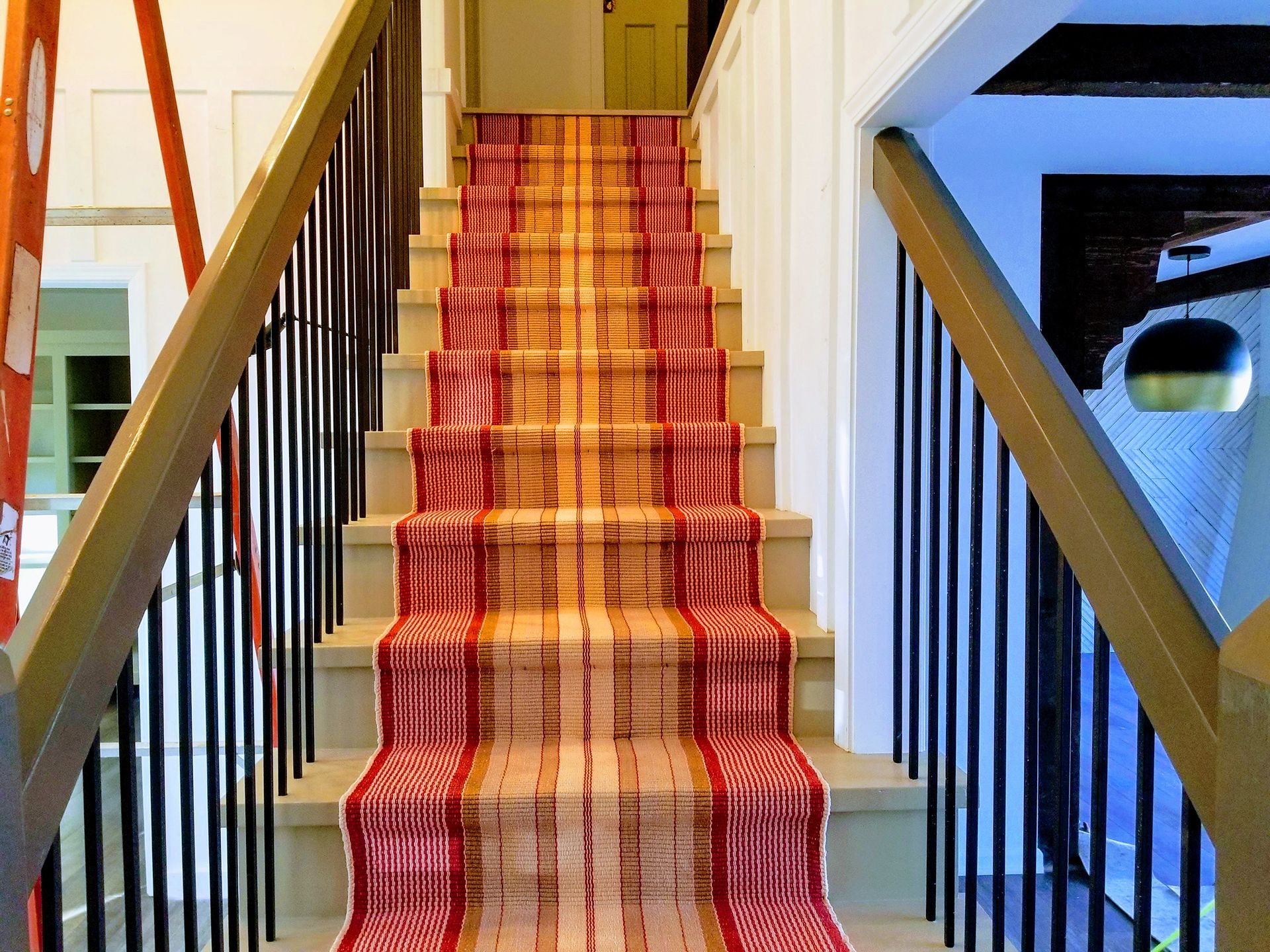 Red & brown stripe floor runner installations