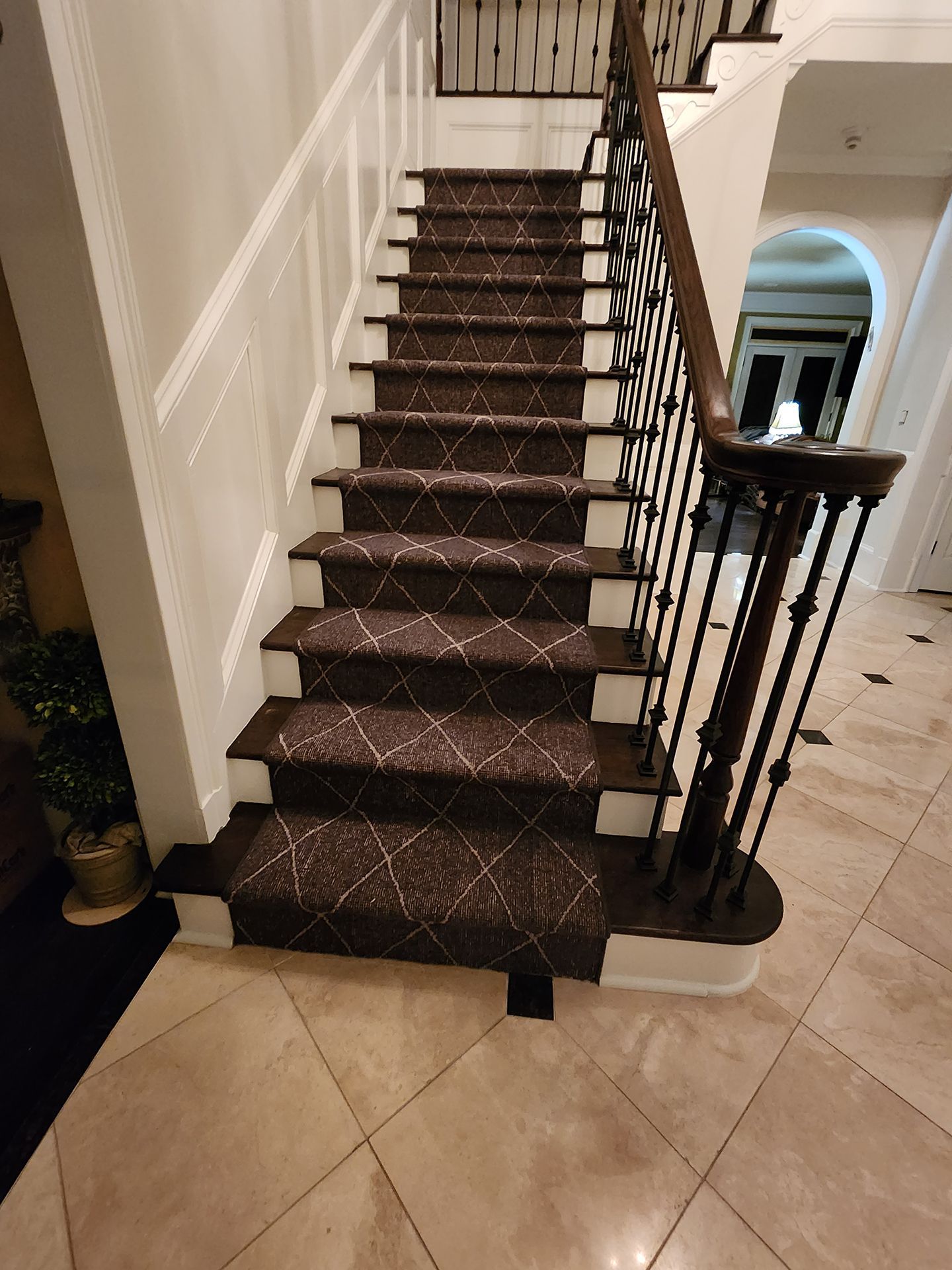 Newly installed black diamond-patterned floor runner