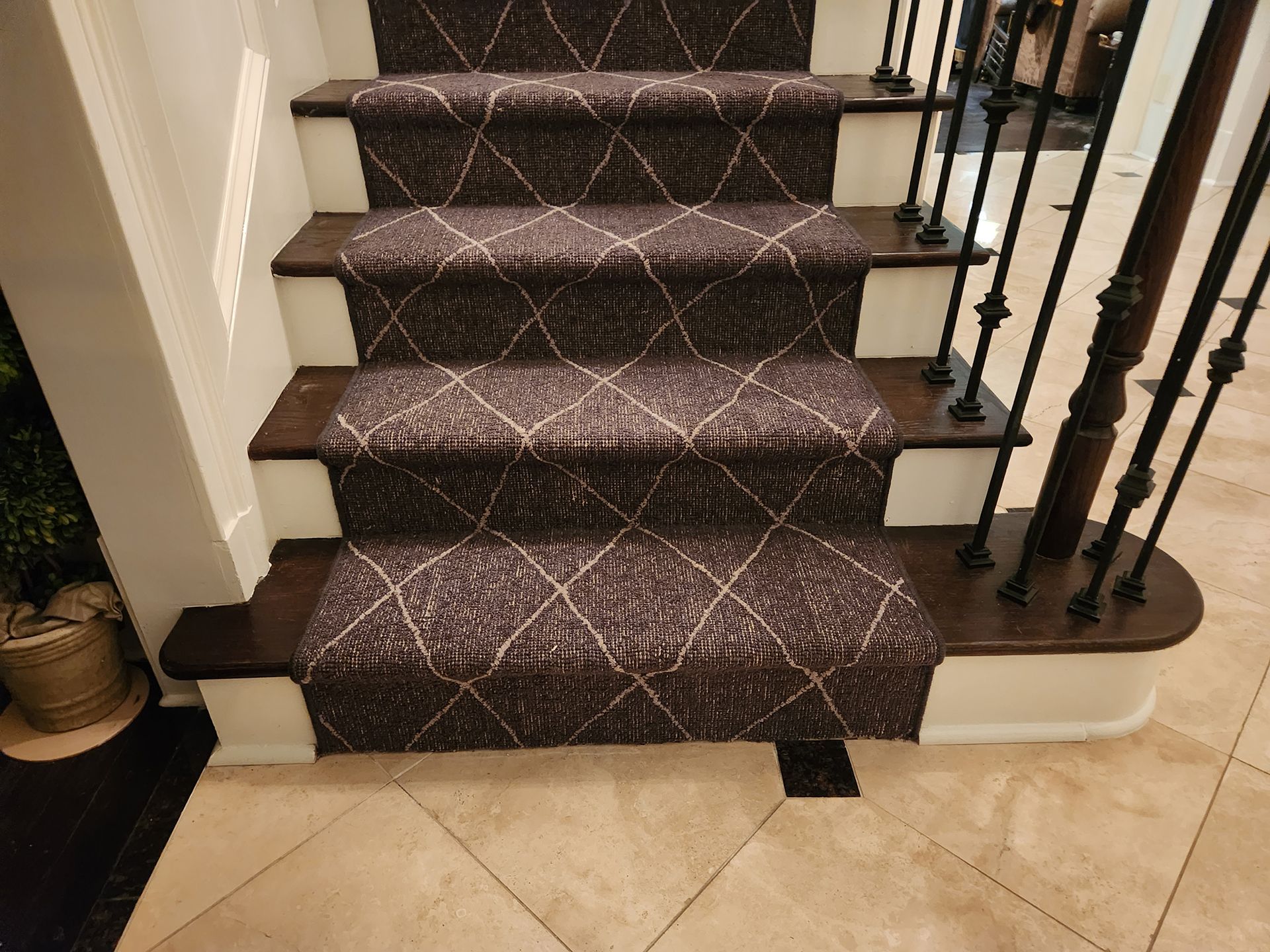 Newly installed black diamond-patterned floor runners