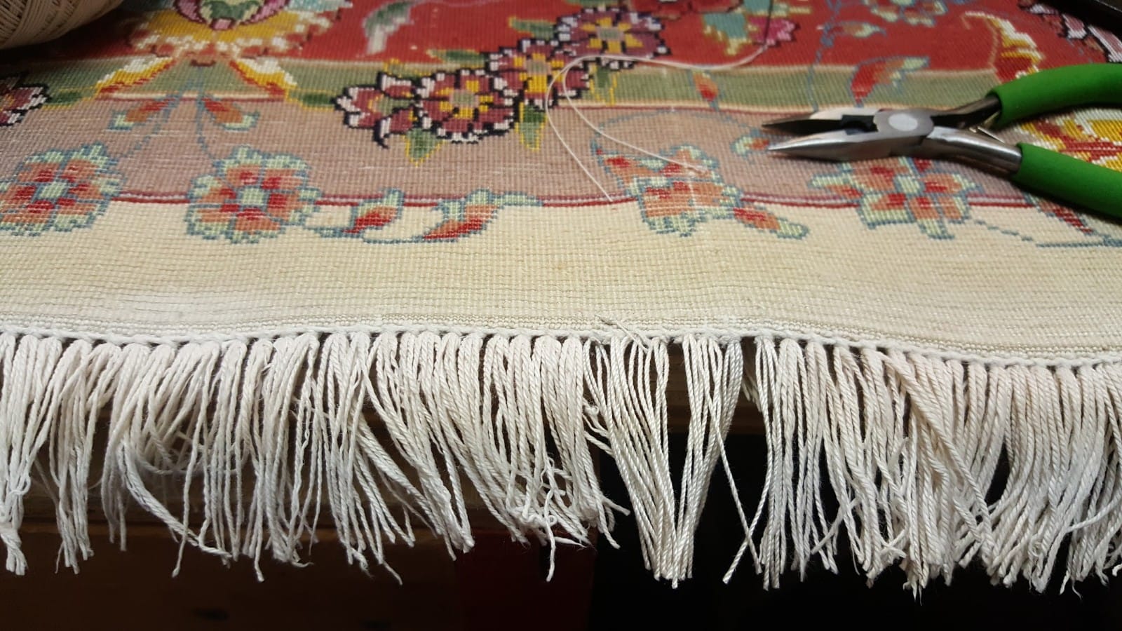 Rug with newly repaired fringe