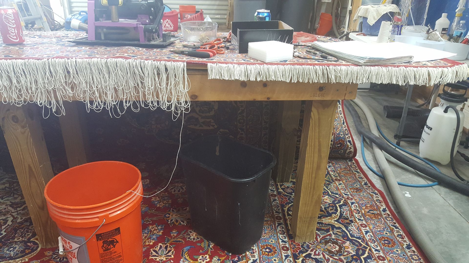 restoring the fringe of the red rug