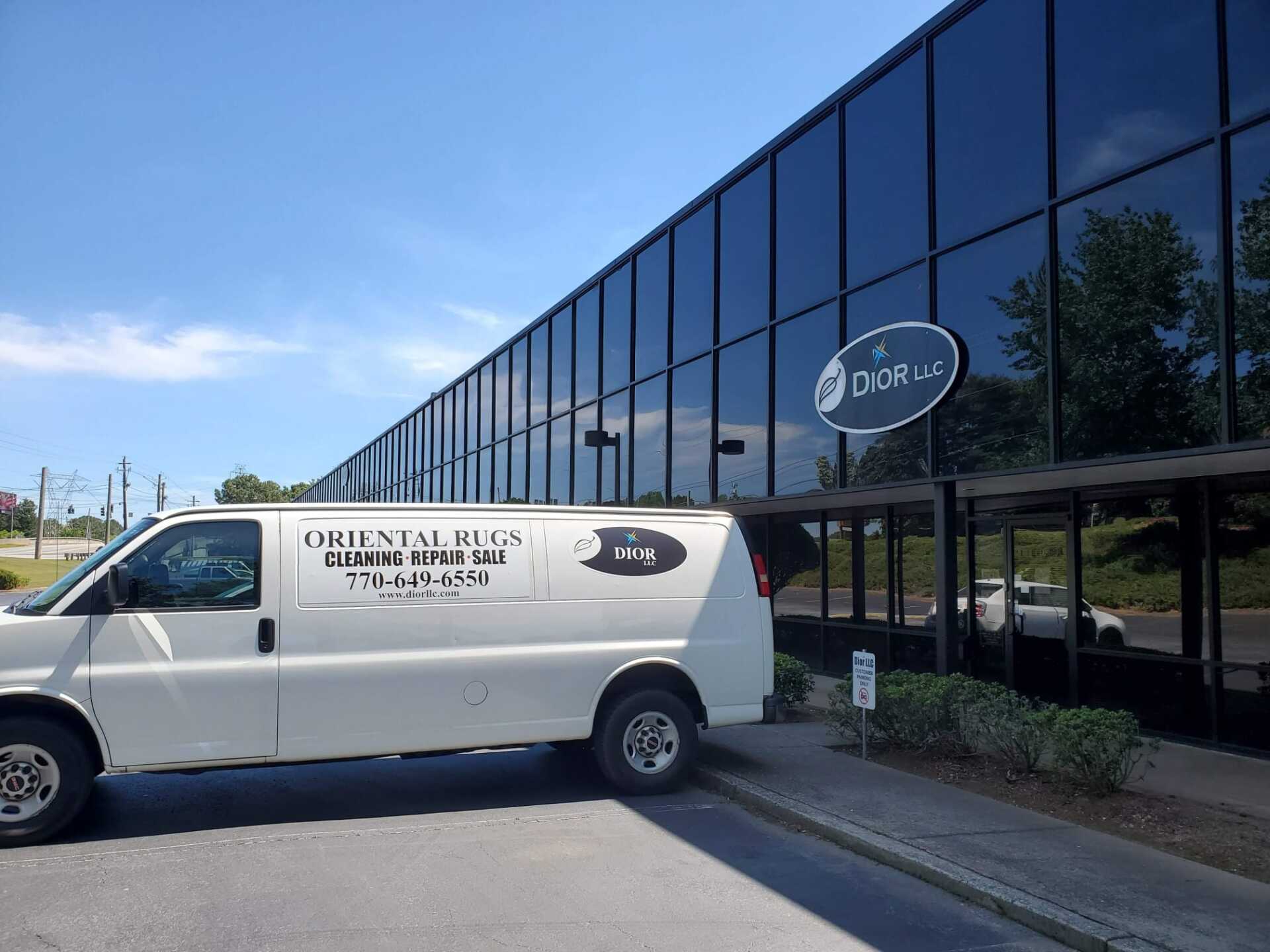 Dior LLC van in front of business