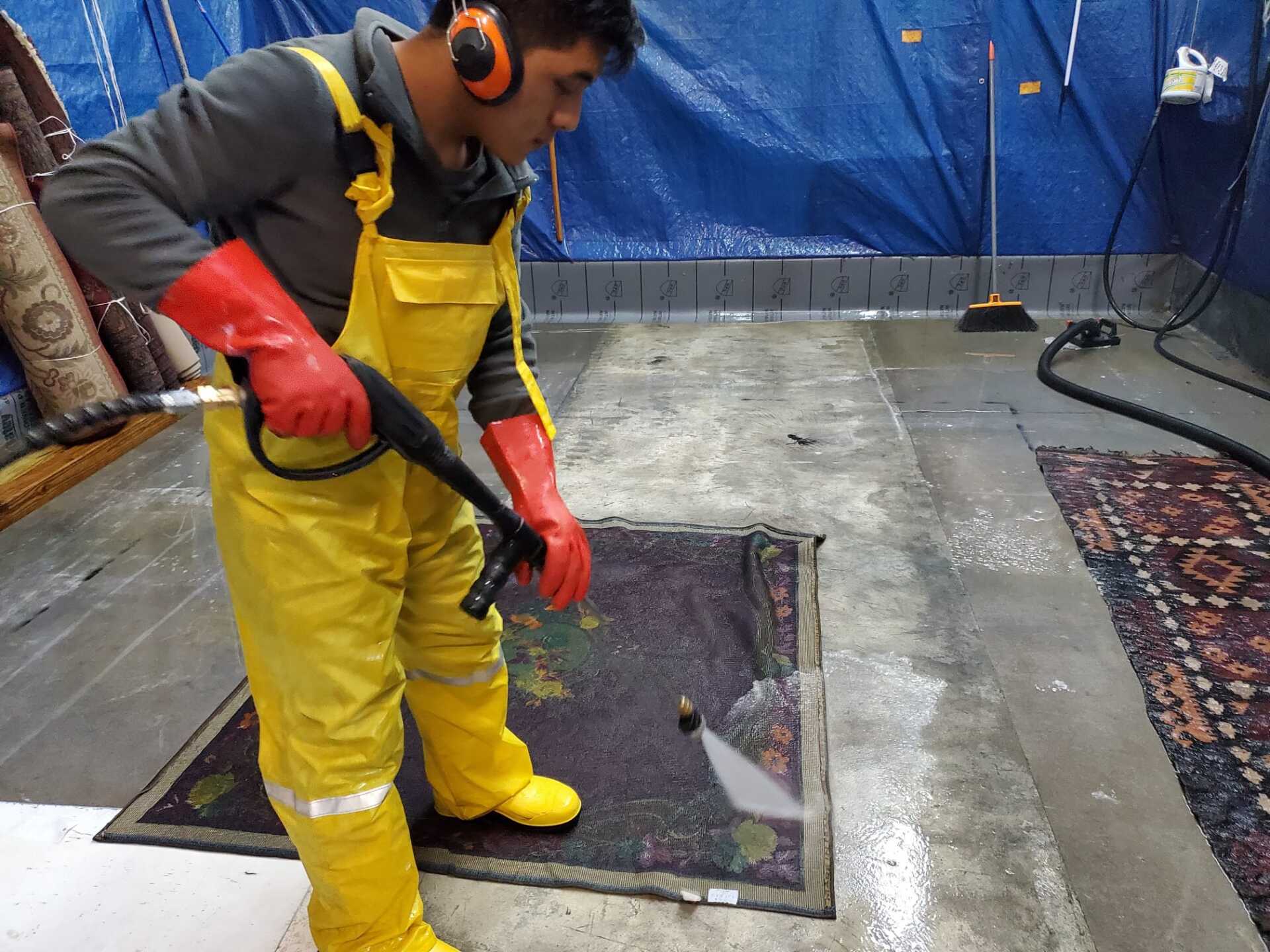 Dior LLC worker washing rug