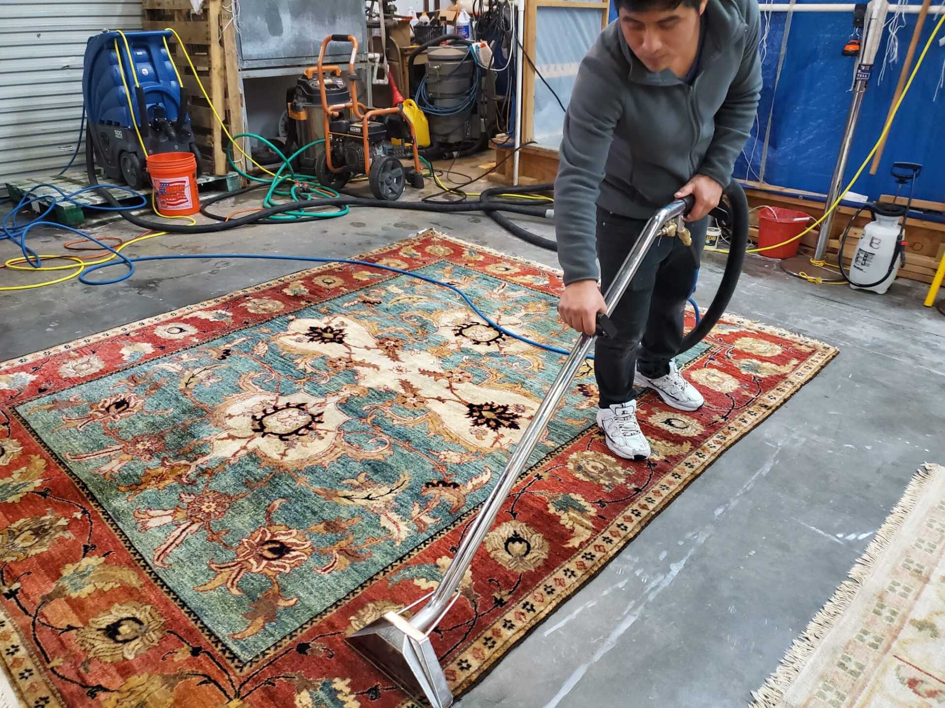 Dior LLC worker drying rug
