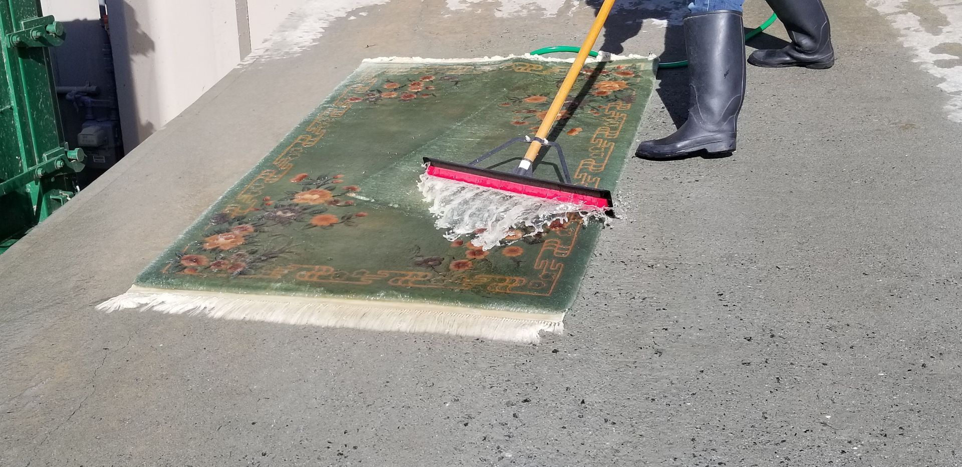 cleaning a green rug