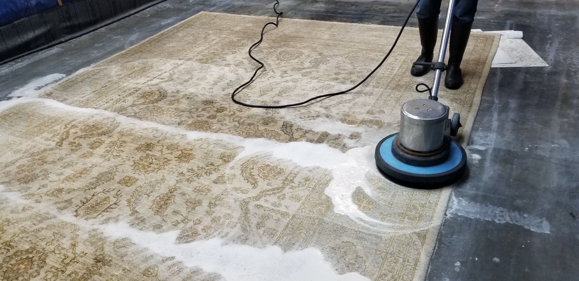 rug cleaning using a rotary floor machine