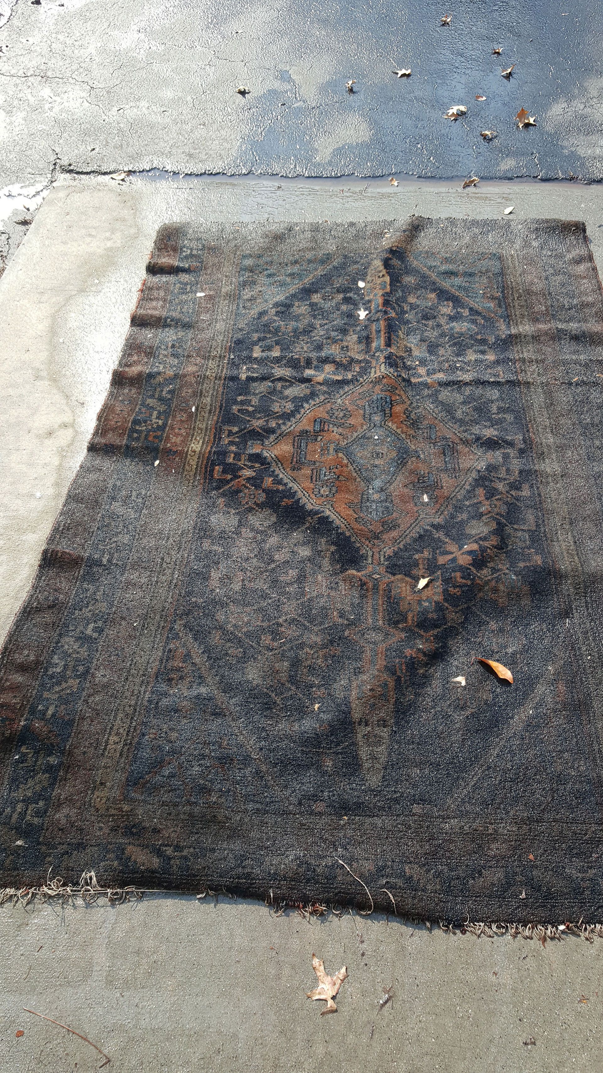 old rug covered with dirt