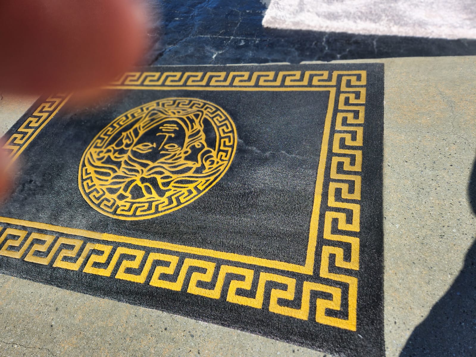 wet black and gold rug