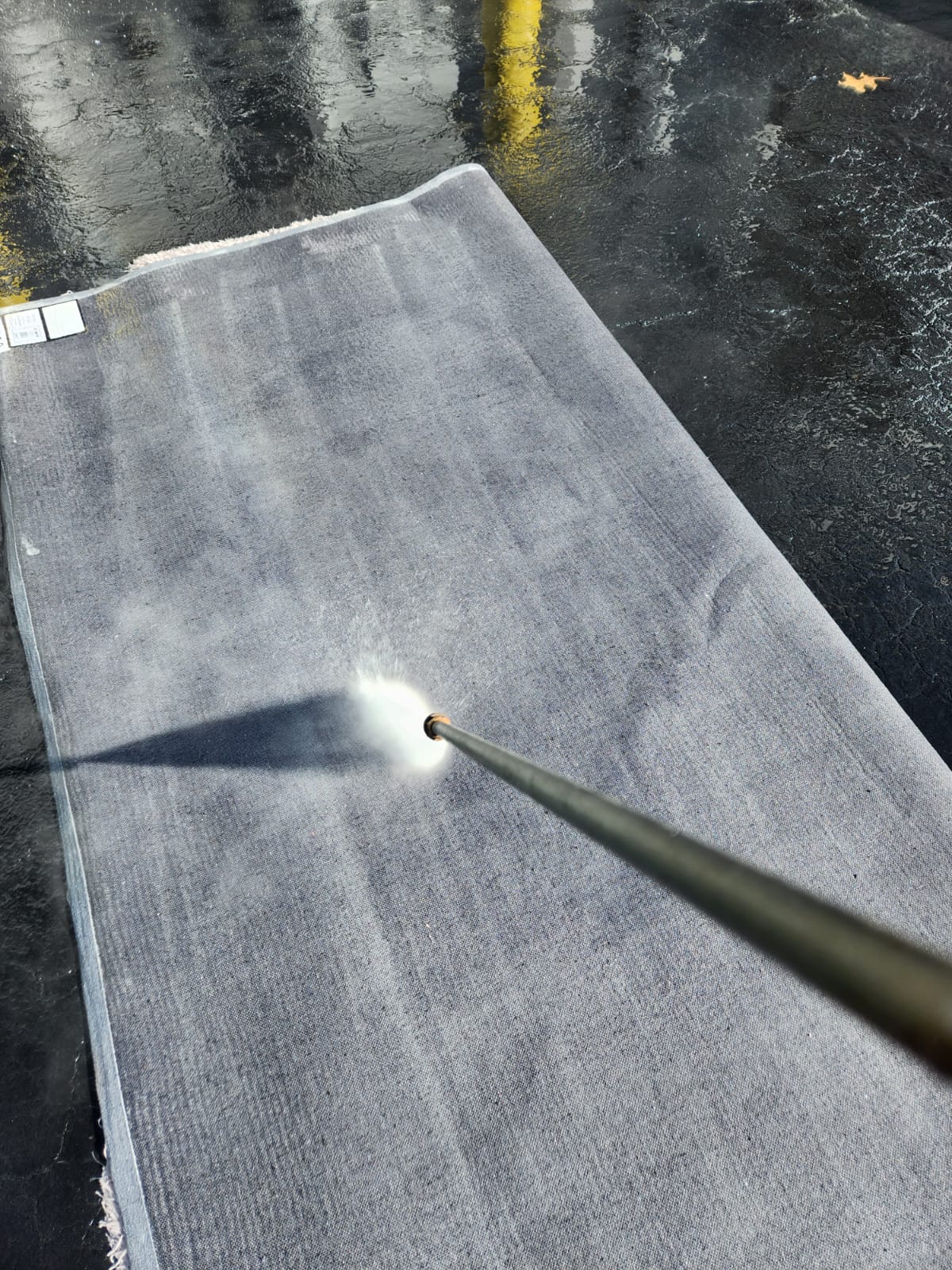 pressure washing the underside of the rug