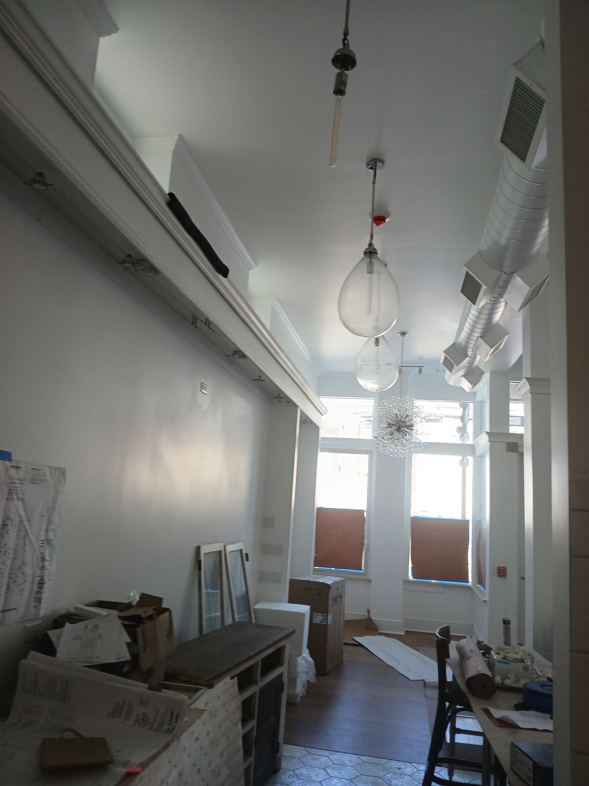 A very long room with a lot of boxes on the floor