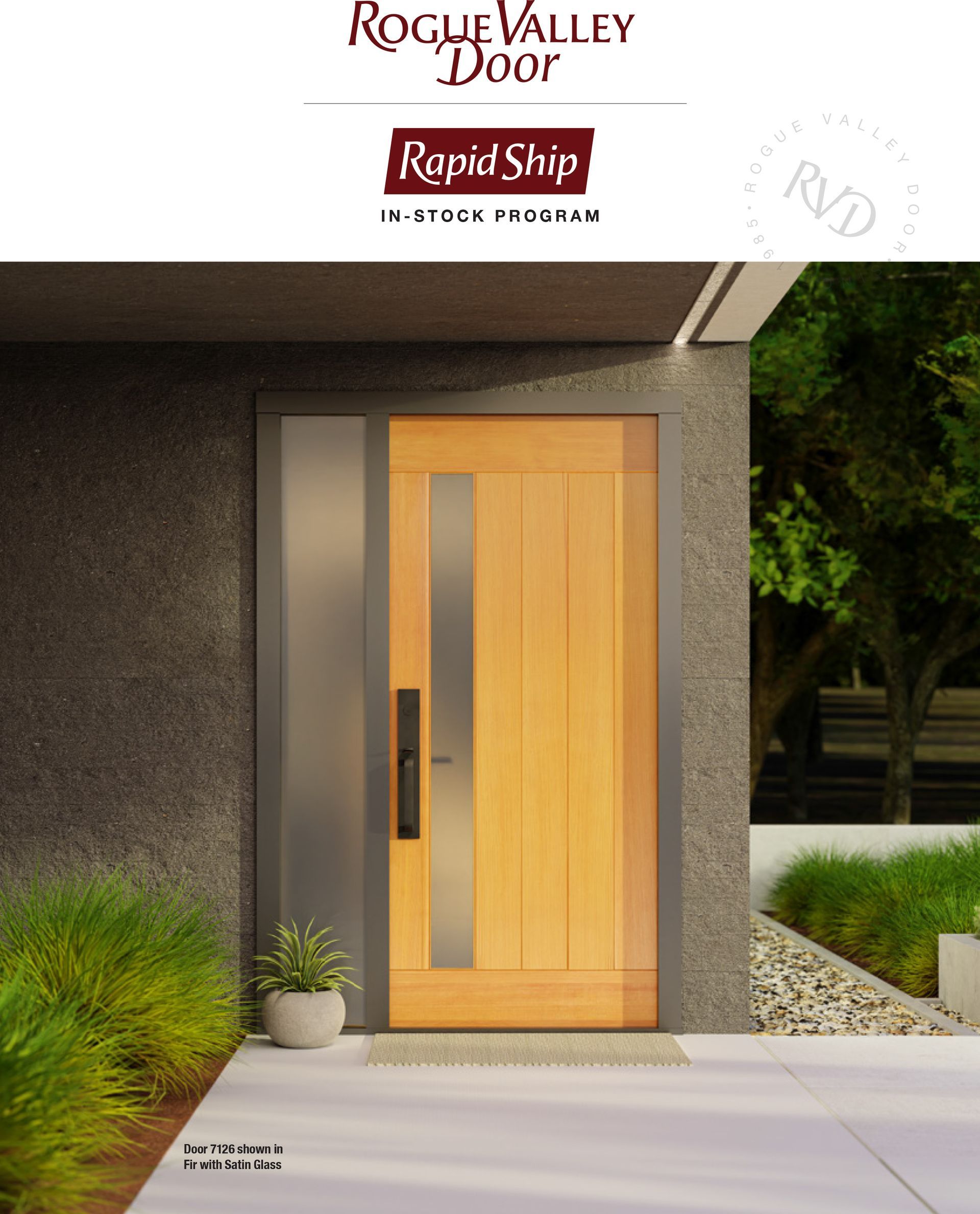 Wooden entry door with glass panel and dark handle, set in a modern, exterior wall.