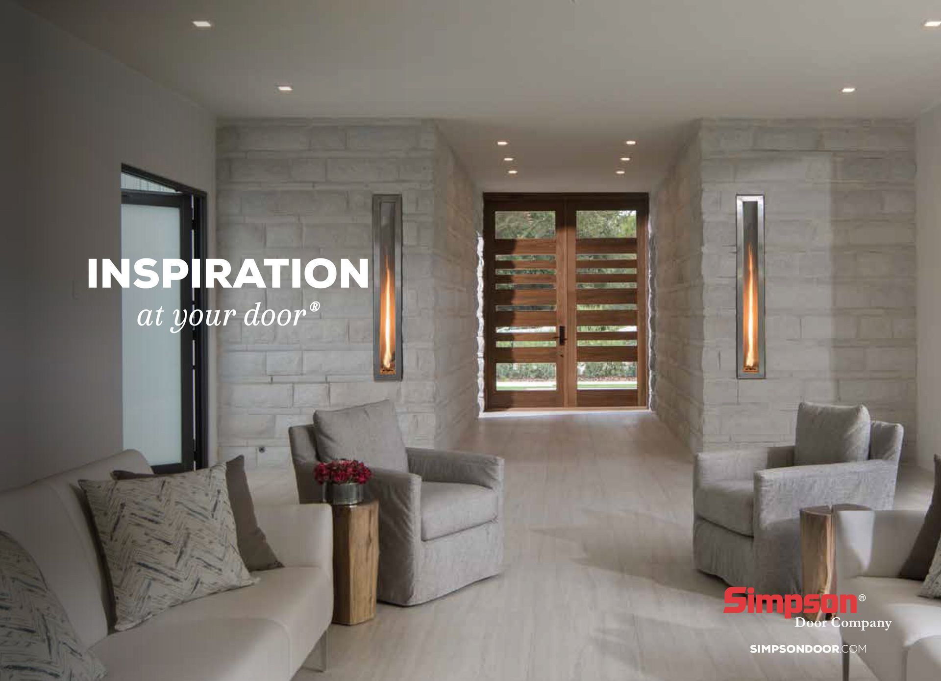 Modern living room with gray furniture, stone walls, and two wall-mounted lights.