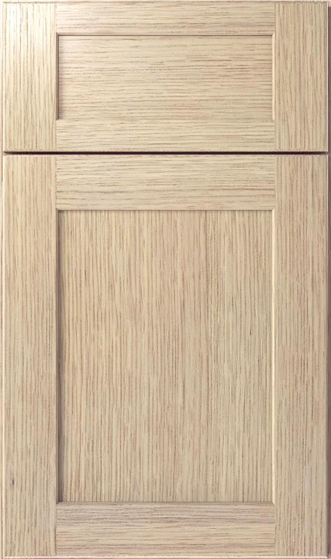 Light wood cabinet door with a smaller upper panel and a larger lower panel