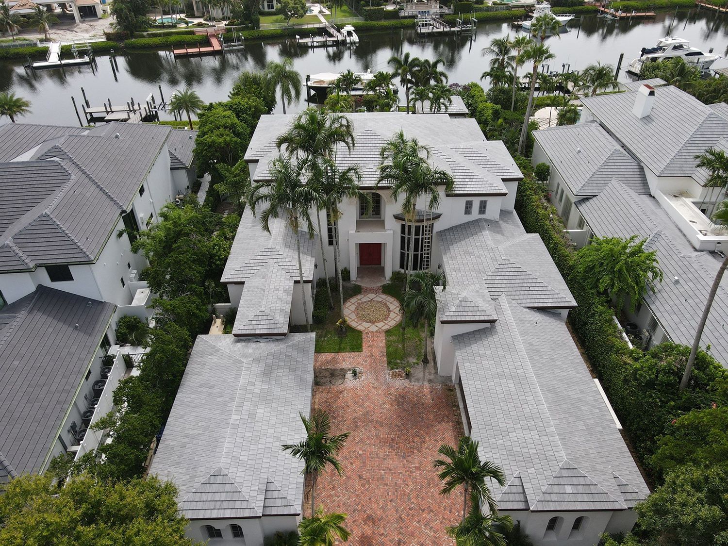 An aerial view of a large house in a residential area