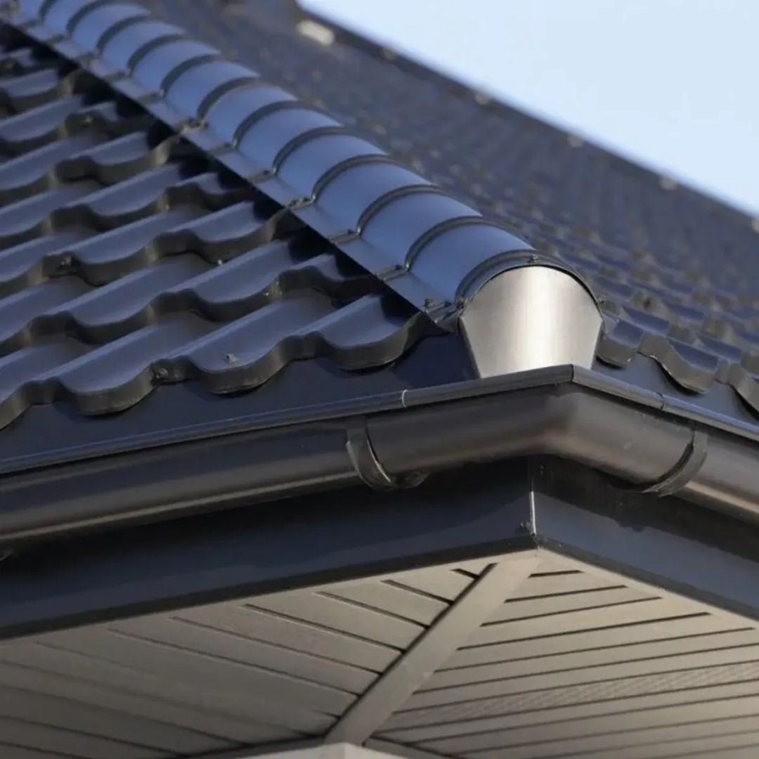 A close up of a gutter on a roof