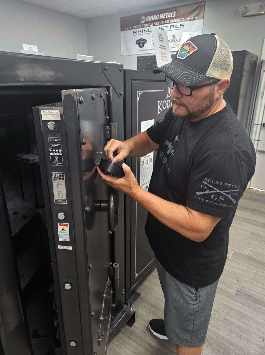 Man swapping a safe's lock