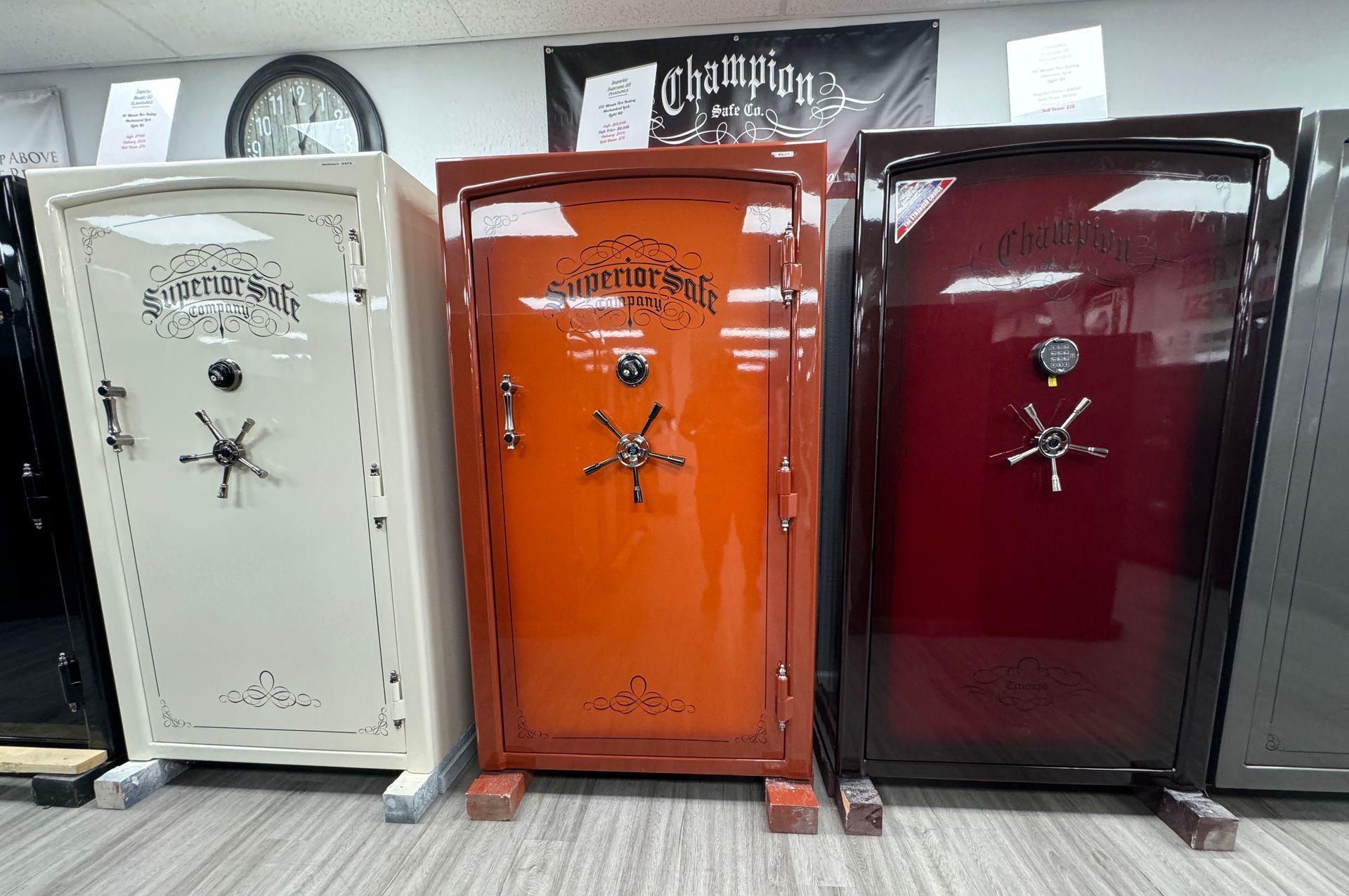 Three safes are sitting next to each other in a room.