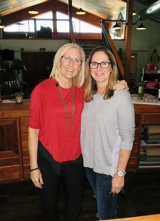 Rustic & Red owners inside of their gift shop