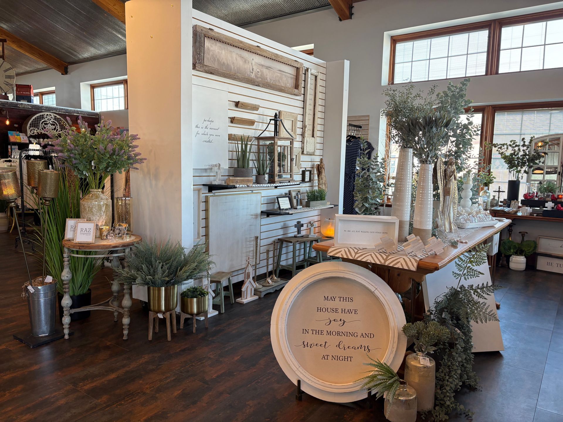 A room filled with lots of plants and decorations.
