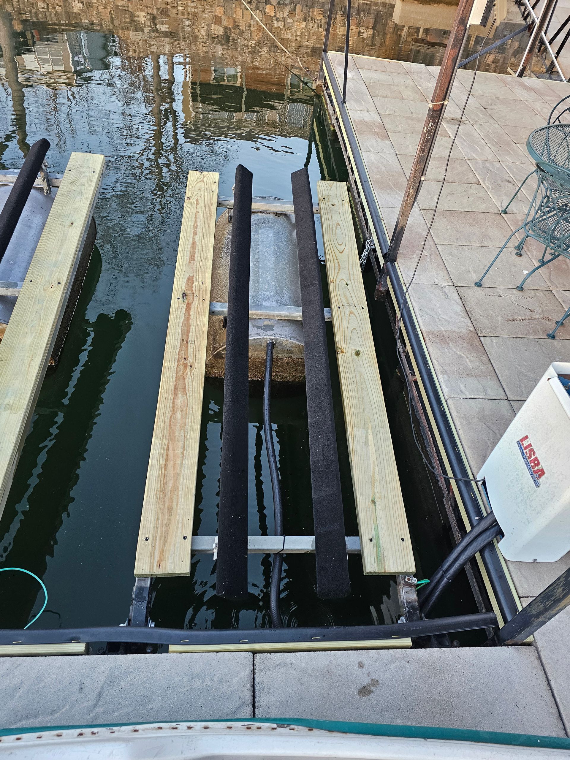A white box that says lg on it is in the water