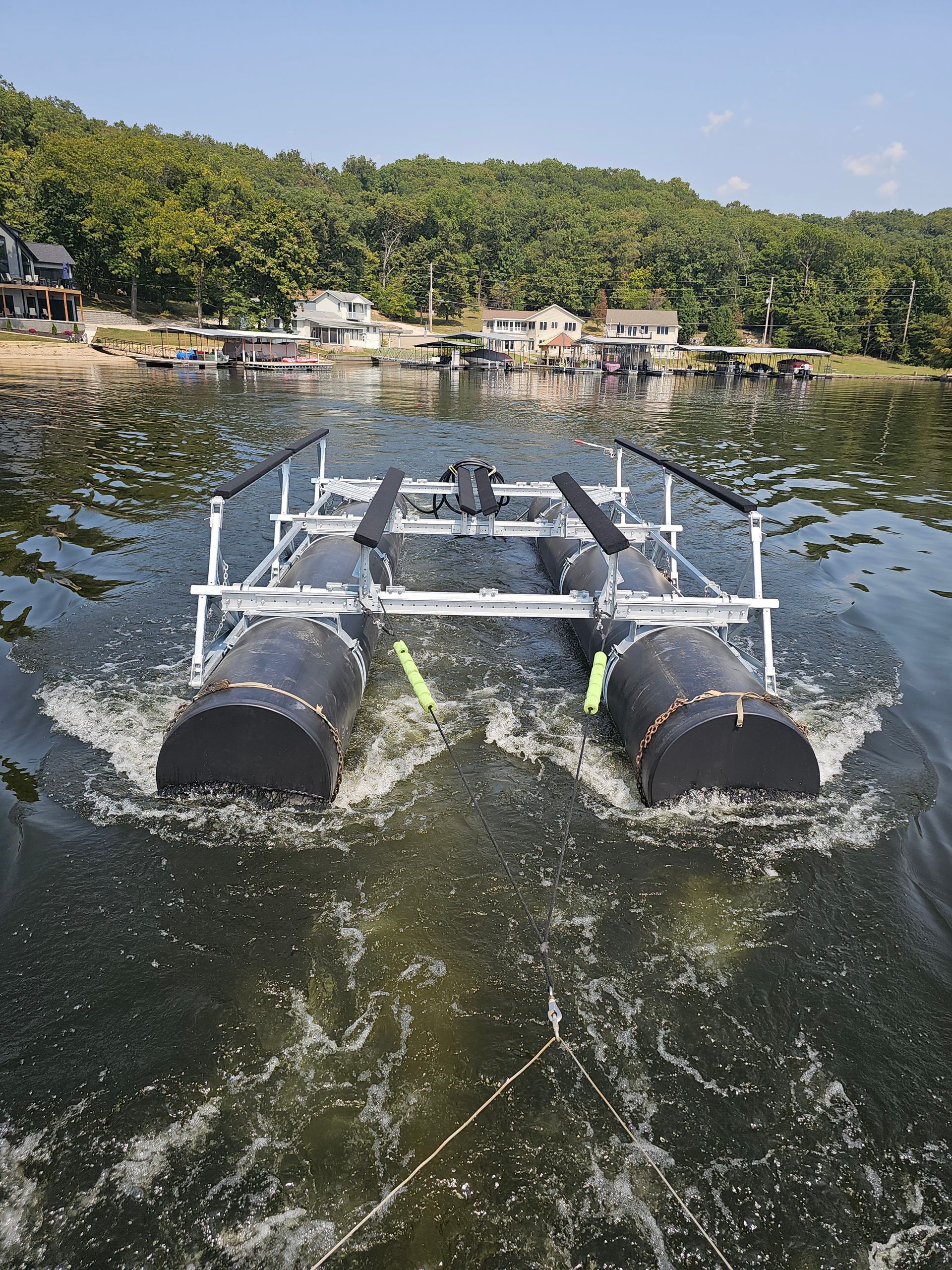 A boat is floating on top of a body of water.