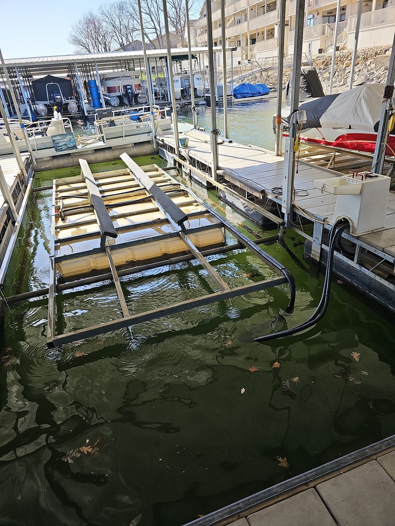 A dock with a lot of boats docked in it.