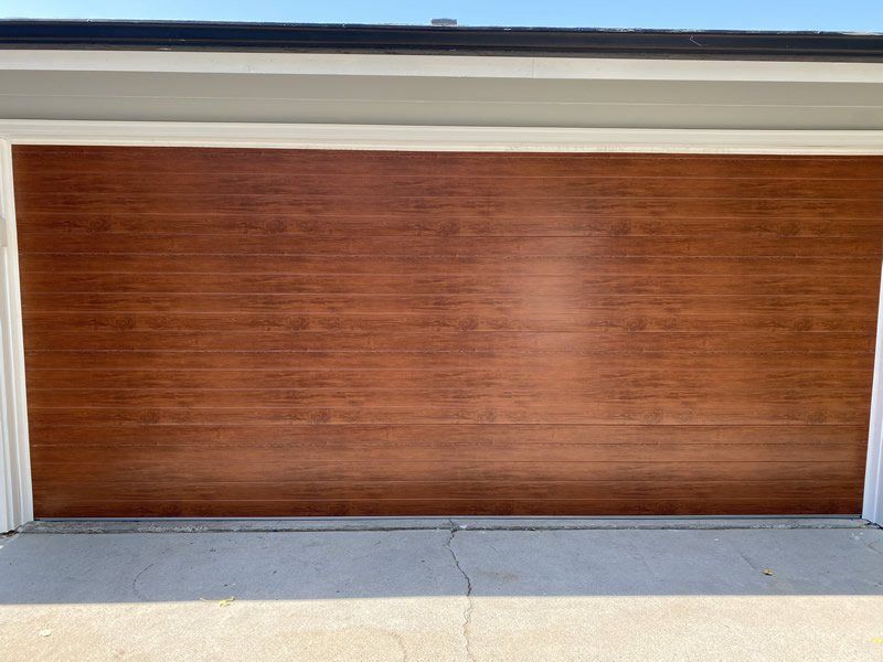 A brown colored steel garage door