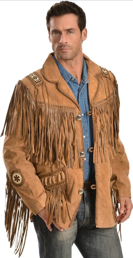 A man wears a tan suede fringe jacket over a denim shirt against a white background.