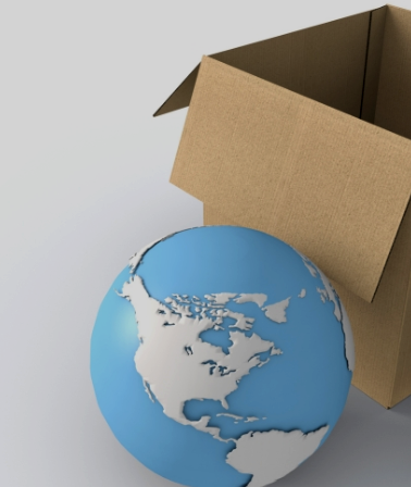 Blue globe beside open cardboard box on a gray background