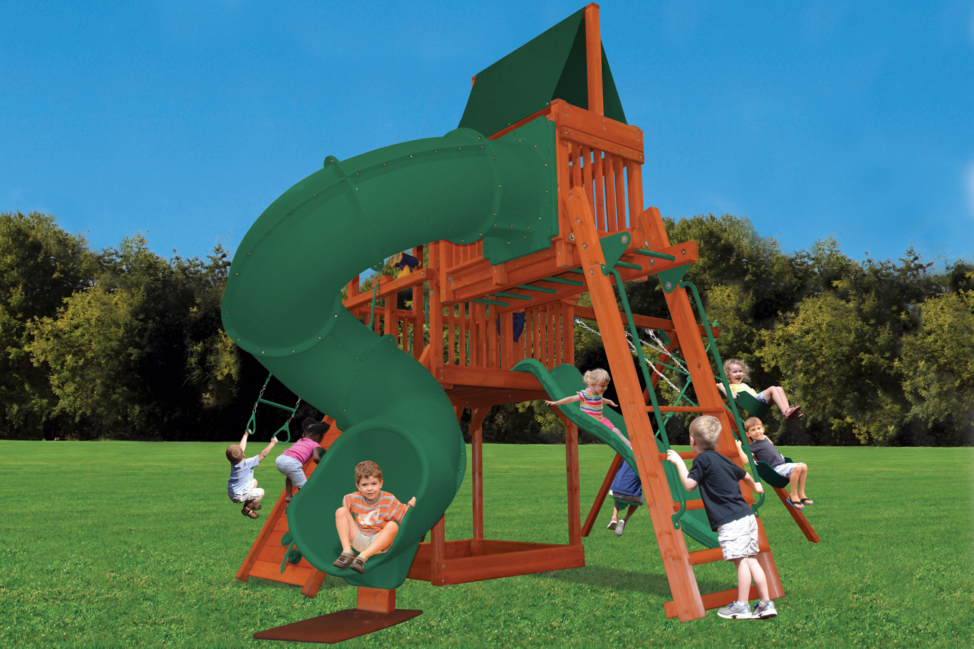 A group of children are playing on a playground with a green slide