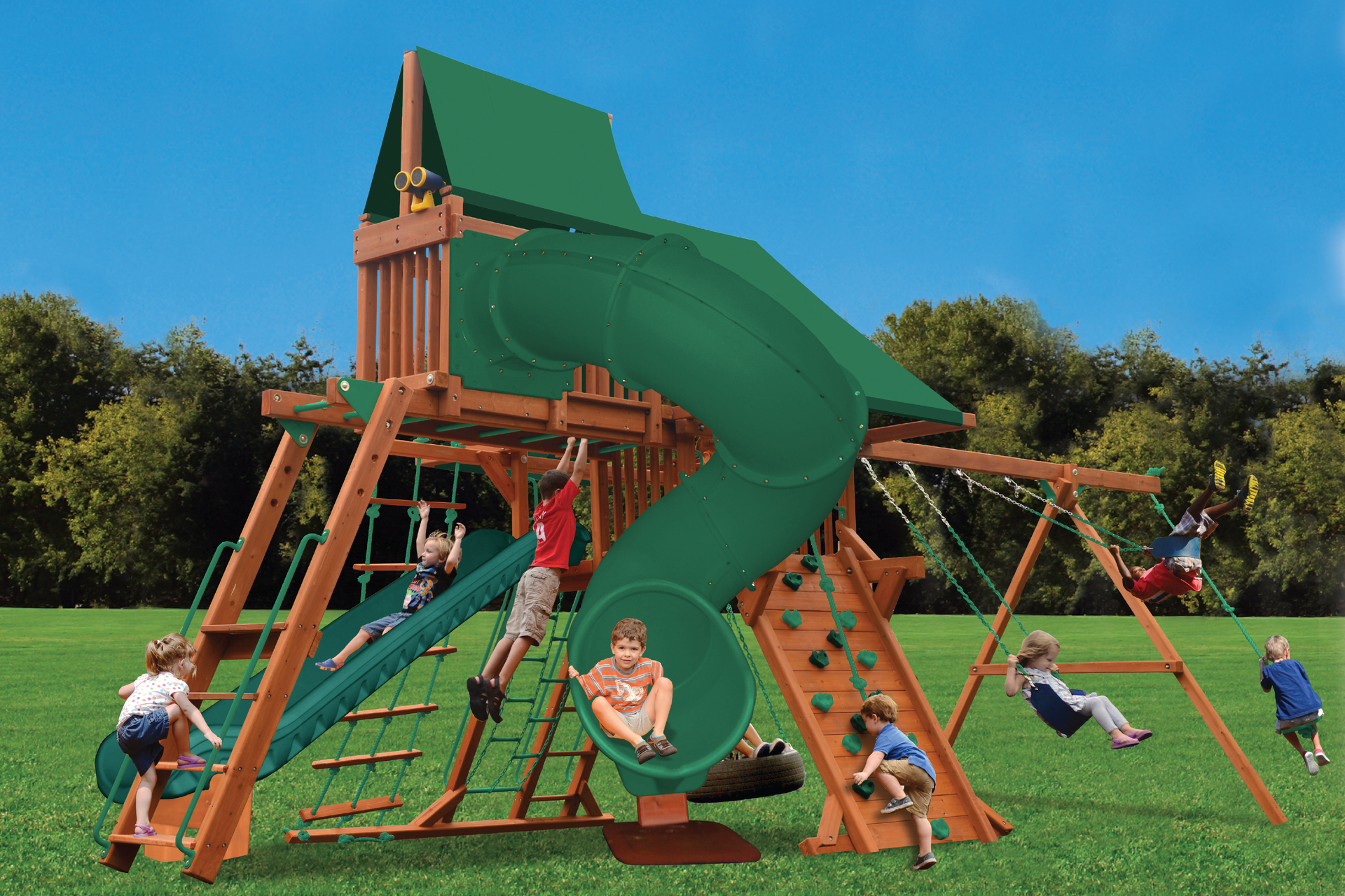 A group of children are playing on a playground with a green slide.