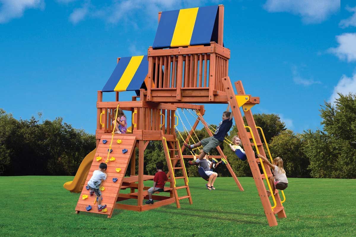 A group of children are playing on a wooden playground set.