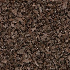A close up of a pile of brown gravel.