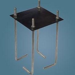 A stainless steel anchor with a black plate on top of it on a blue background.