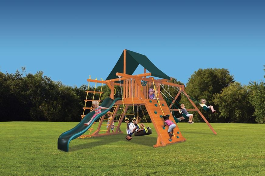 A group of children are playing on a playground with a slide.