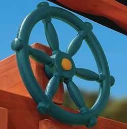 A green steering wheel is attached to a wooden structure.