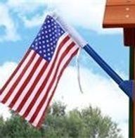 A close up of an american flag hanging from a pole.