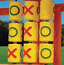 A close up of a tic tac toe game on a playground.