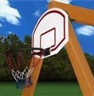 A basketball hoop is attached to a wooden swing set.
